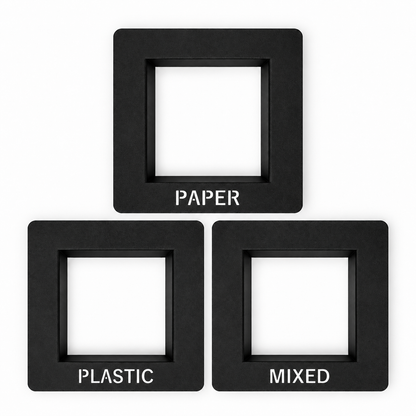 Set of three black countertop waste chute frames labeled PAPER, PLASTIC and MIXED